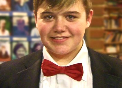 Ian Birch joins the choir as a full (and our youngest) member at the Christmas Concert in the New Vic Theatre, Newcastle-under-Lyme, 17th of December.